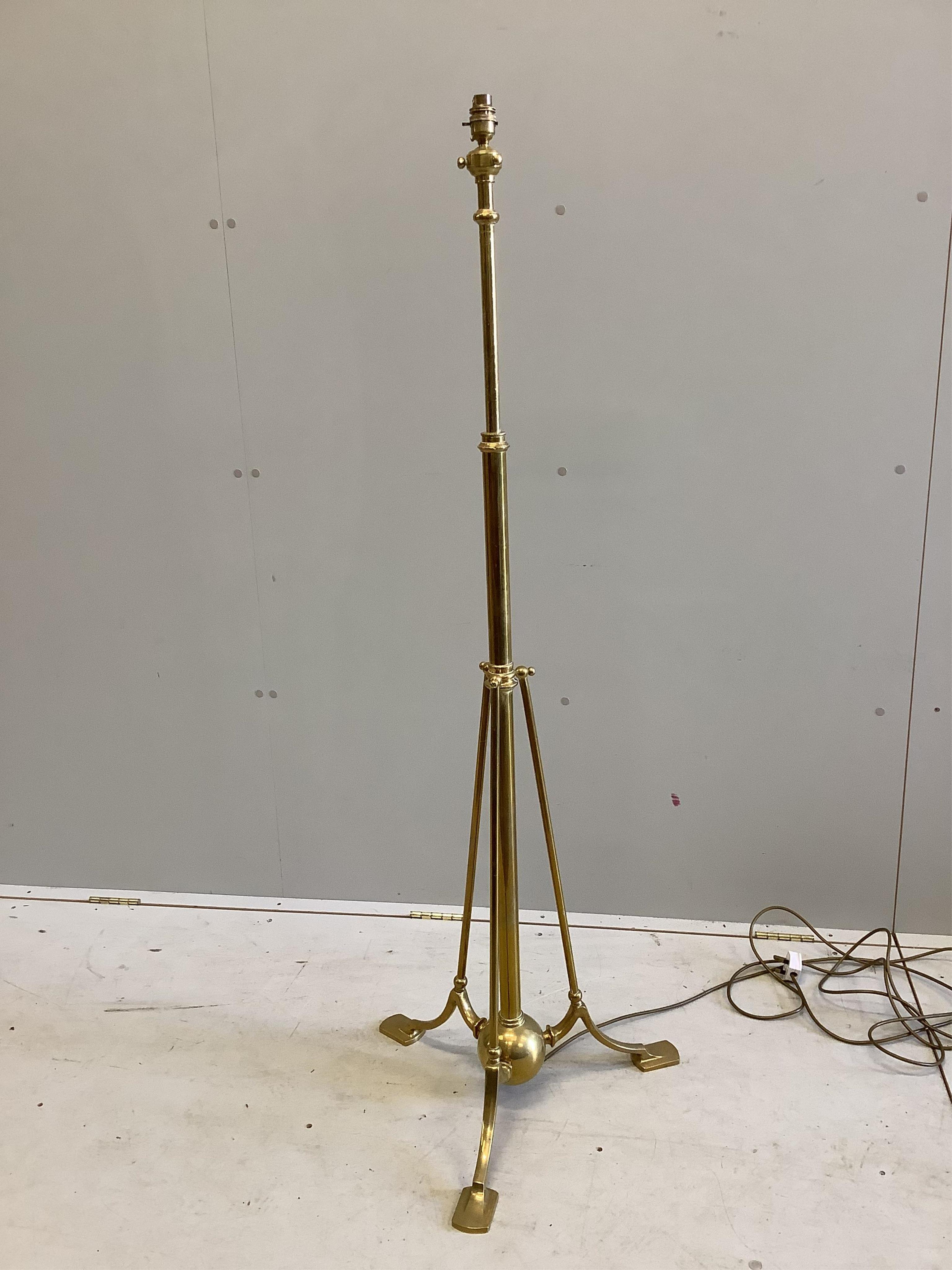 An Edwardian brass telescopic lamp standard, in the manner of Benson, height 140cm. Condition - good